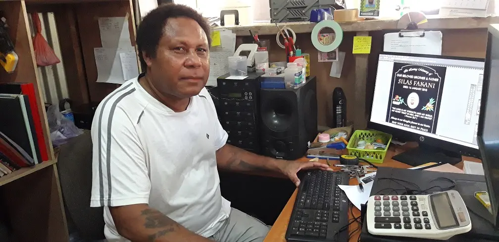 Peter Kennedy Bubulu at his graphic signs and headstone studio.