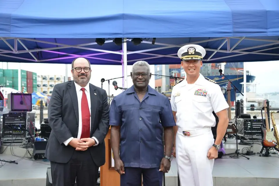 (L-R) Russ Comeau, U.S. Chargé D'Affaires for Solomon Islands, Manasseh Sogavare, Prime Minister of the Solomon Islands, and Capt. Kim, mission commander of Pacific Partnership 2022.