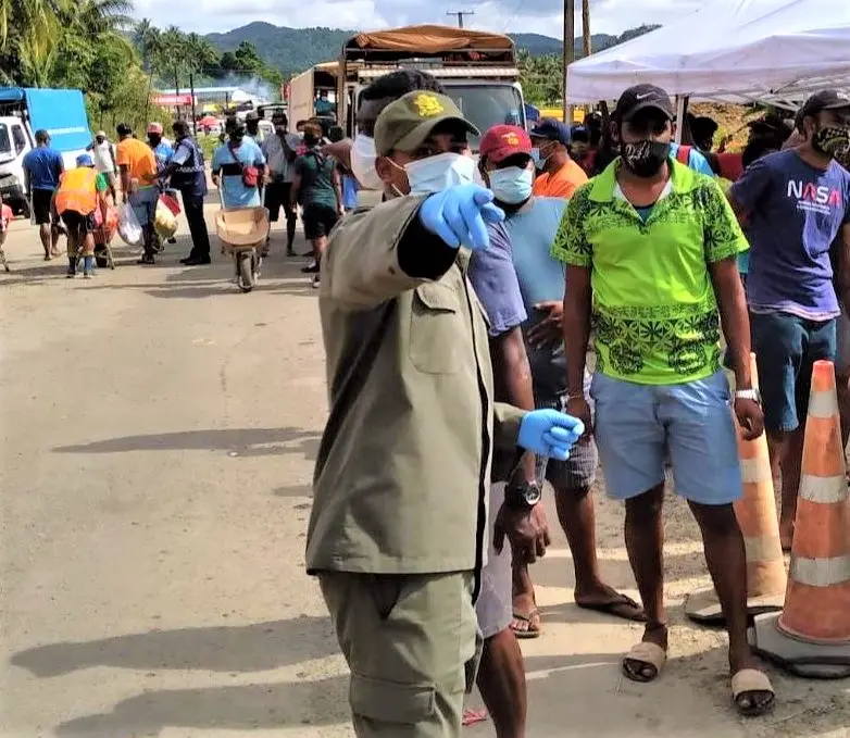 Fiji military directing people at a COVID-19 testing centre in the Lami-Suva-Nausori containment area.