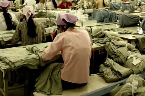 Women are over-represented in lower paid occupations such as these garment workers in Southeast Asia.
