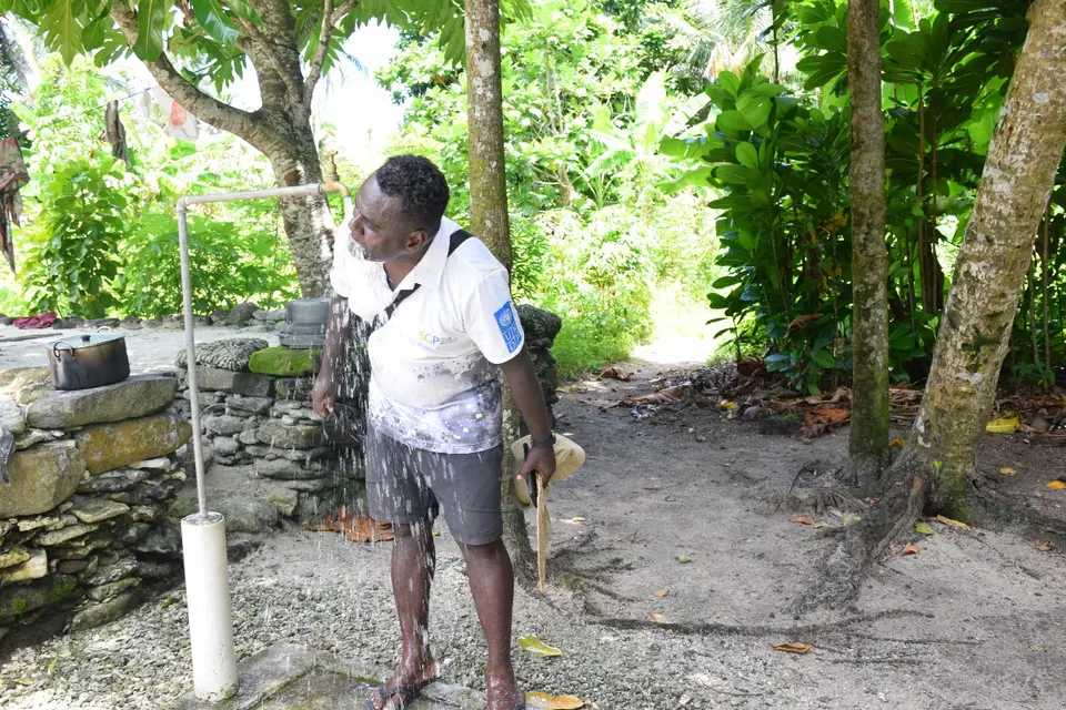 Mr. Teiba Mamu, SGP Project Manager drinking from one of the new project’s tap in Tikopia.