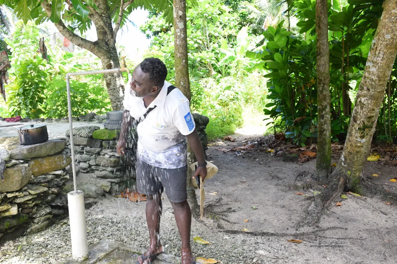 Mr. Teiba Mamu, SGP Project Manager drinking from one of the new project’s tap in Tikopia.