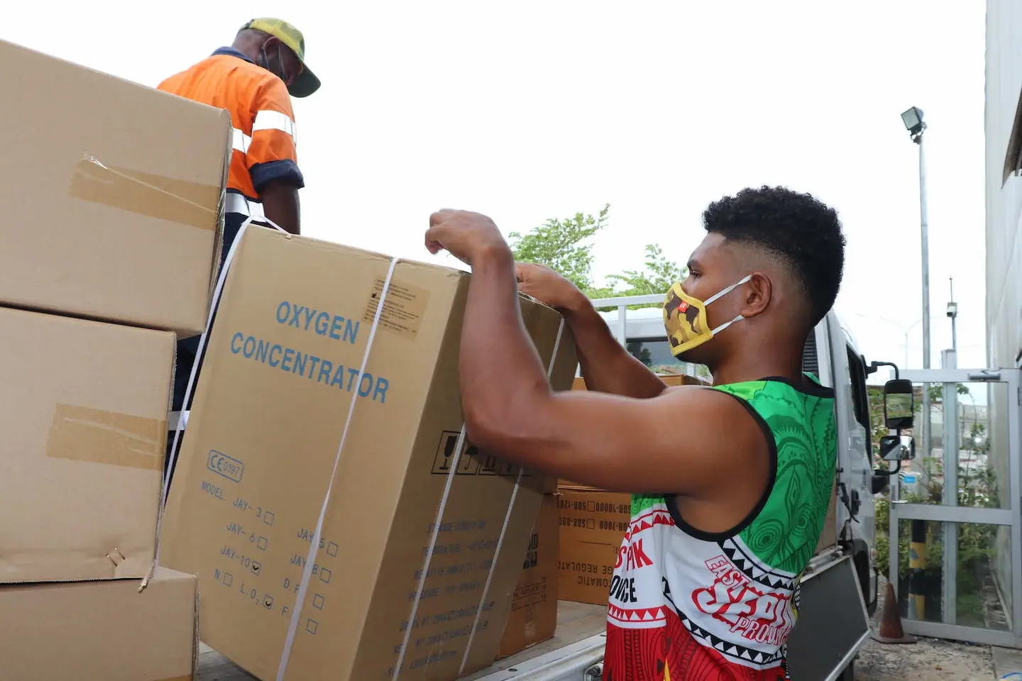Oxygen concentrators are unloaded in April at Jacksons airport, Port Moresby, PNG.