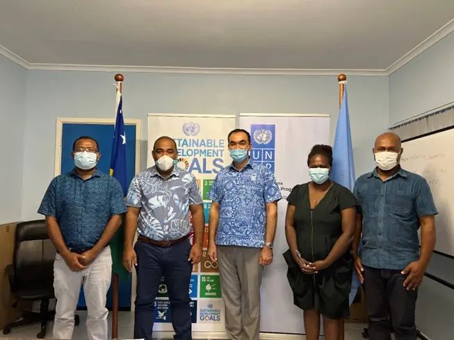 Representatives from MECDM and UNDP at an LoA Signing Ceremony.