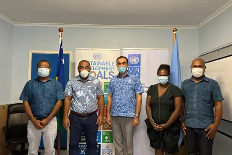 Representatives from MECDM and UNDP at an LoA Signing Ceremony.