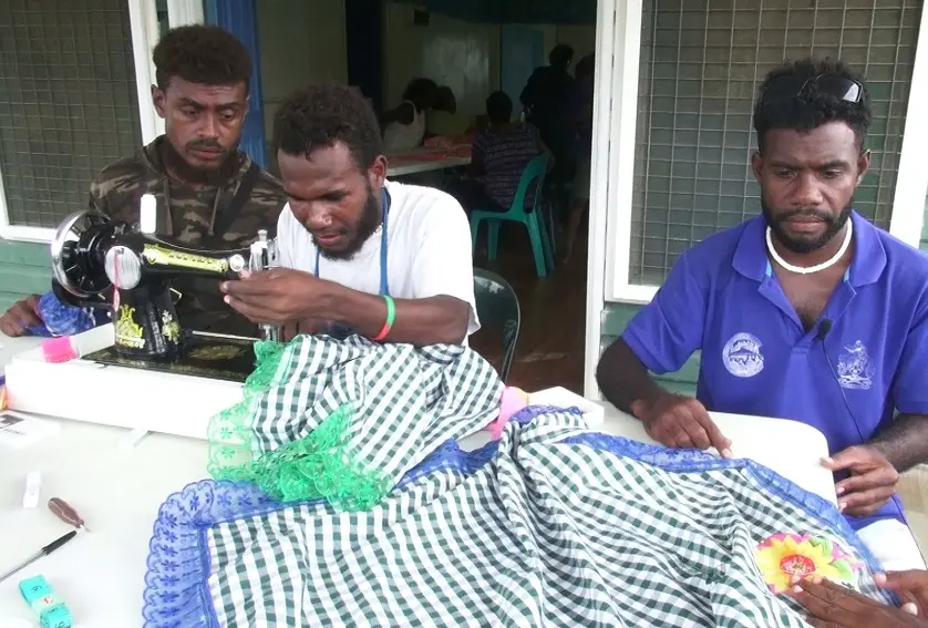 Henry, Rex and Patterson at the sewing class facilitated by the Guadalcanal Provincial Council of Women.