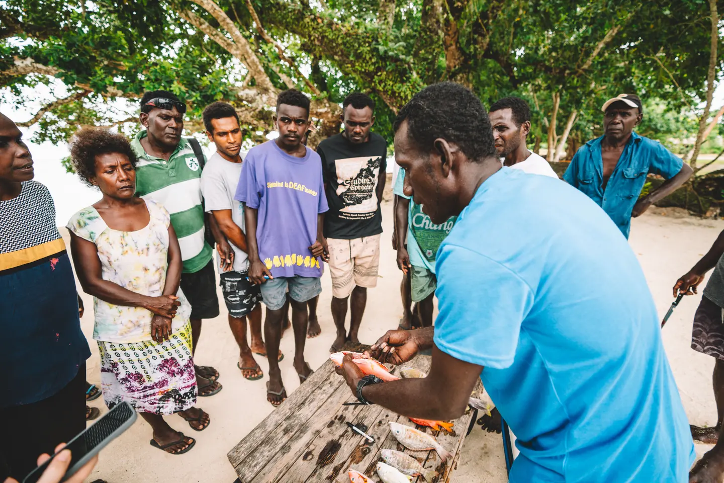 Mr. Alpha Gelly, Sairagi Community Facilitator in Sairagi, Solomon Islands, demonstrating the Spawning Potential Survey (SPS) tool which communities use to better manage community based fisheries.