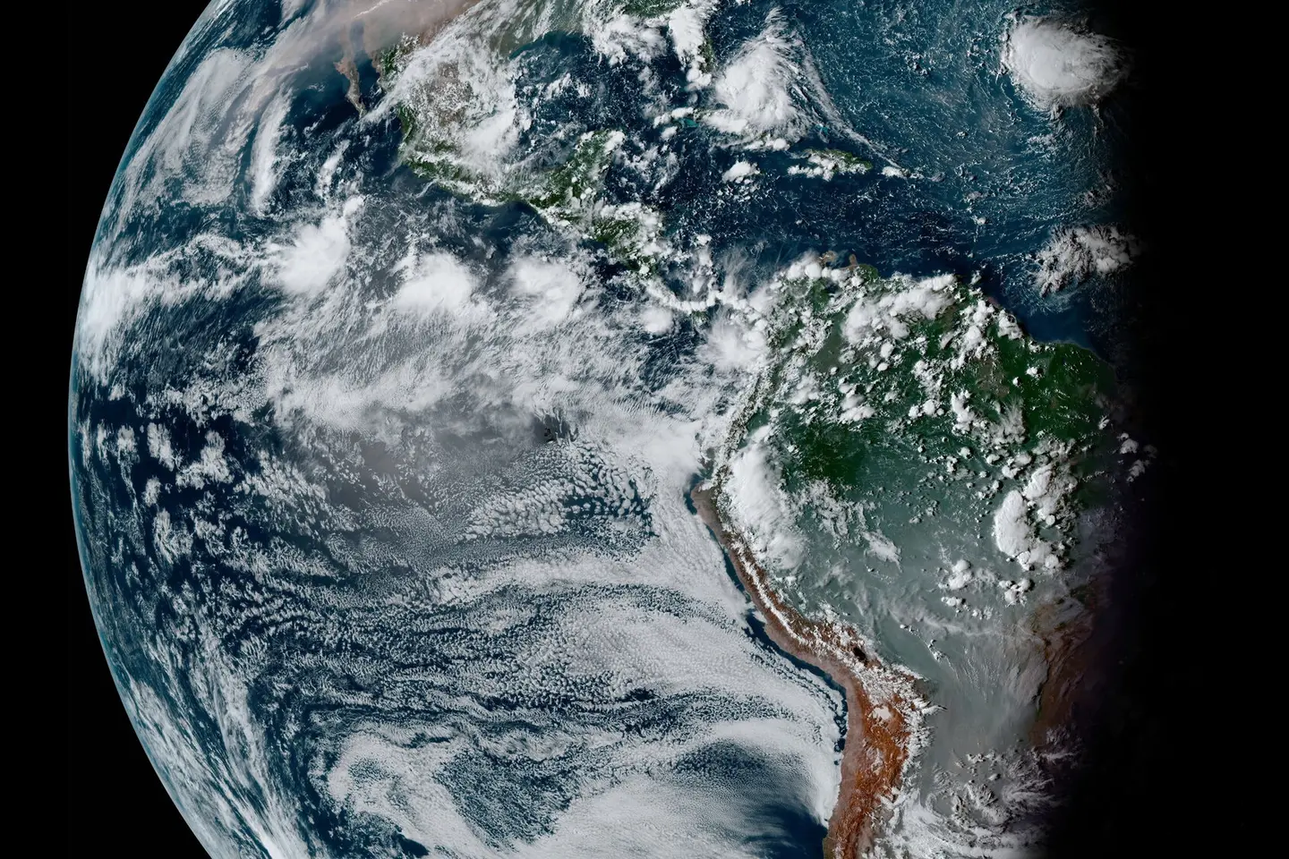 Waning gibbous Earth taken by the GOES-16 satellite on Sept. 11, 2020. Smoke from fires in the Amazon and Pantanal of Brazil dominates South America. A vast vector of smoke expands across North America and the Pacific from West Coast wildfires.