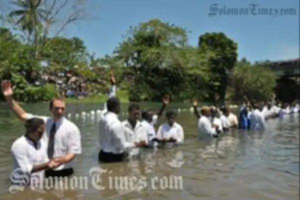 Adventist pastors baptizing new church members in the Lunga River last week.