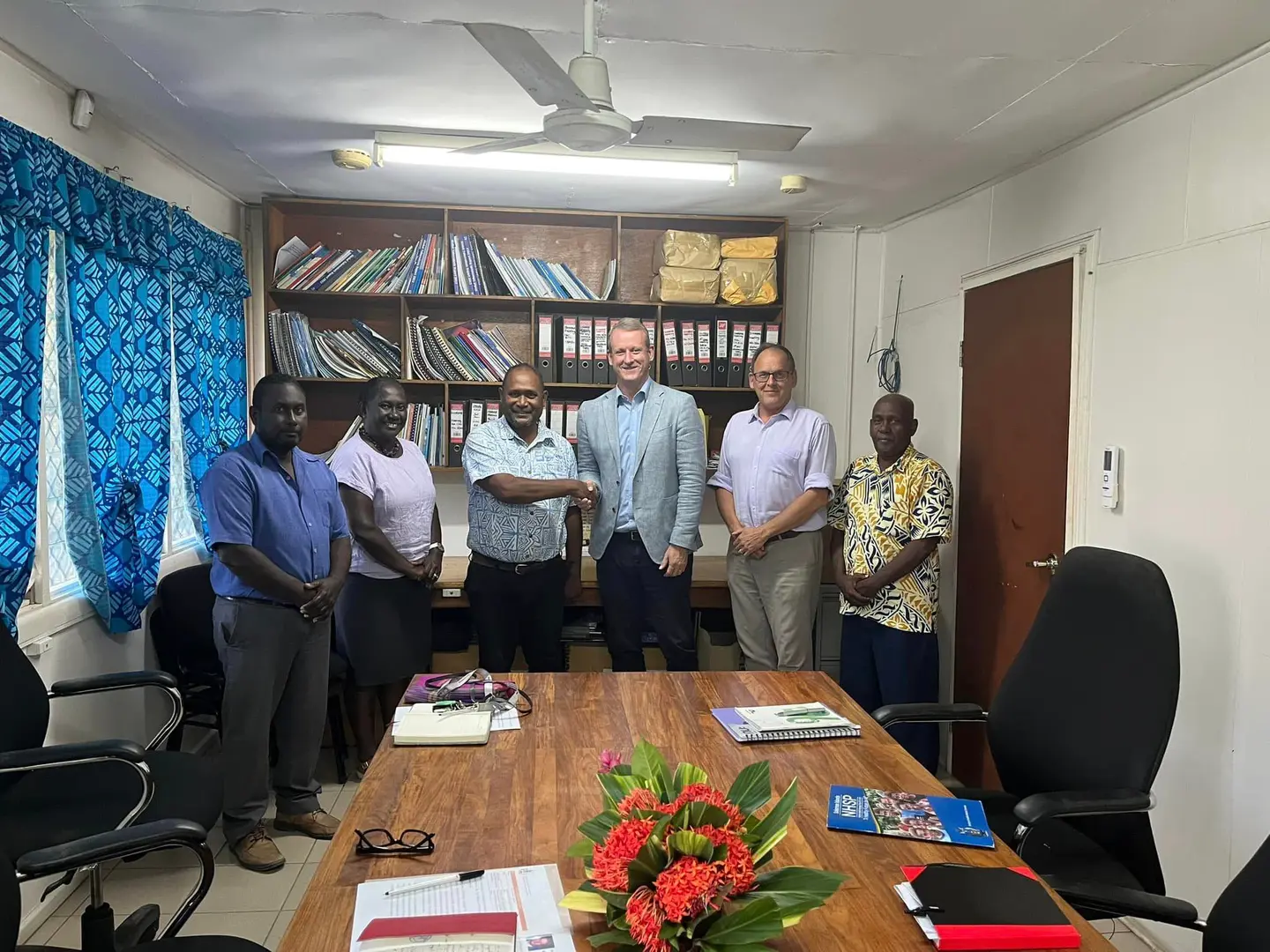 L-R Dr Gregory Jilini Deputy Secretary Health Care, Health PS Mrs. Pauline McNeil, Health Minister Dr Culwick Togamana and Australia High Commissioner to SI Mr. Rod Hilton shaking hands, Counsellor Human Development, Mr Mika Kontiainen and Director Policy and Planning Mr. Ivan Ghemu.