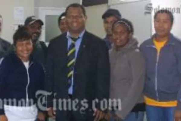 Steve Abana (third left) with officials and fellow Solomon Islanders at Aongatete.