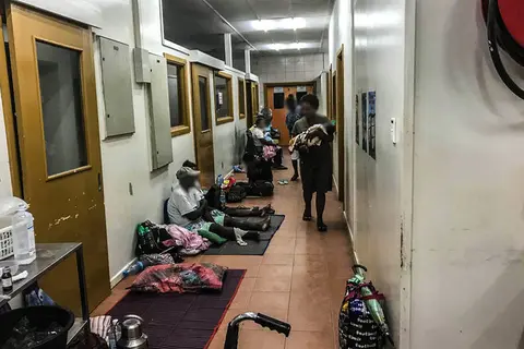 Patients wait along the corridor in the triage area of the National Referral Hospital in Solomon Islands.
