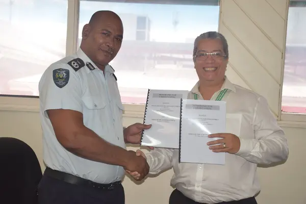 RSIPF Commissioner Mr. Mostyn Mangau and Auditor General David Dennis with the signed MOU.
