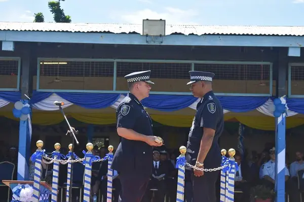 Outgoing Police Commissioner Varley handed the ‘sword’ over to Acting Commissioner of Police, Mostyn Mangau.