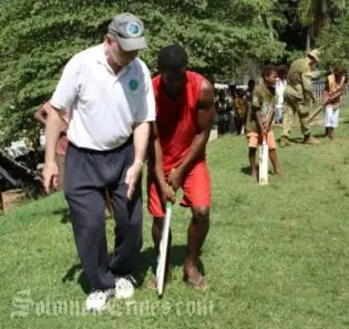 S.I Cricket Association member, Mr. Graeme Wilson during a cricket lesson.