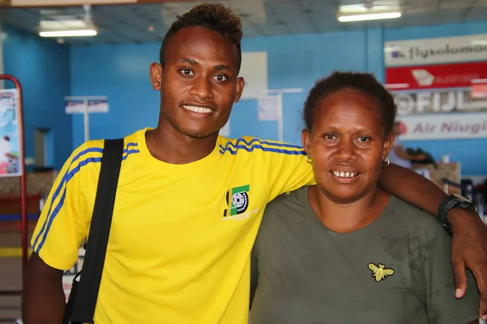 Youngster, Raphael Ohanua Leai with his proud mother at the Honiara International Airport.