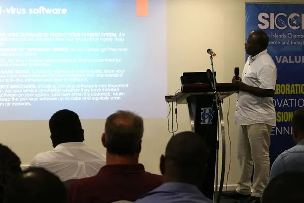 SICCI ICT Strategy Analyst, Moses Tadokata delivering his presentation on the Fibre Optic Cable, opportunities and associated risks to members of the business community during the information session hosted by SICCI.