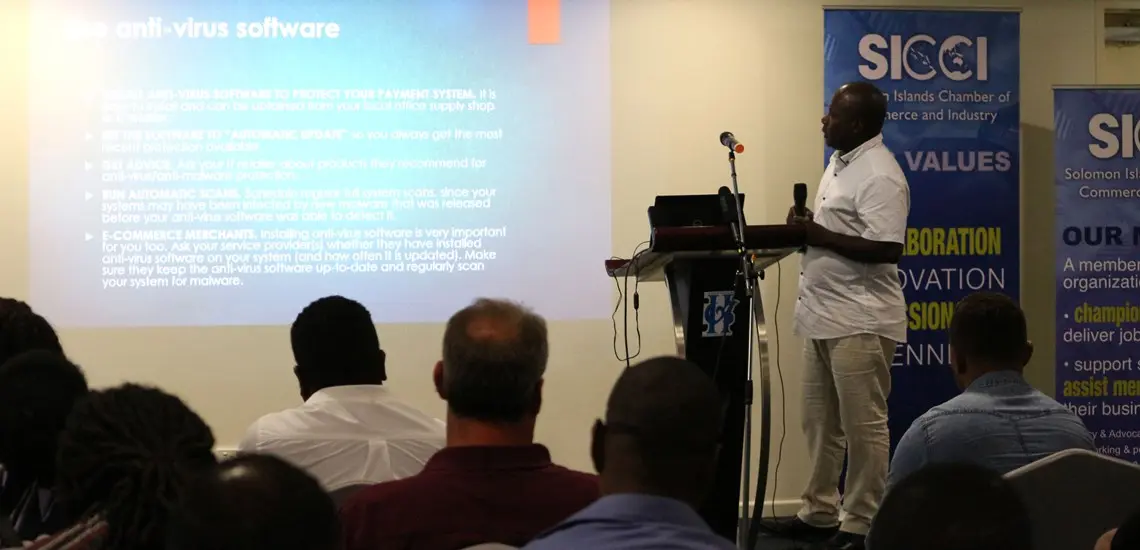SICCI ICT Strategy Analyst, Moses Tadokata delivering his presentation on the Fibre Optic Cable, opportunities and associated risks to members of the business community during the information session hosted by SICCI.