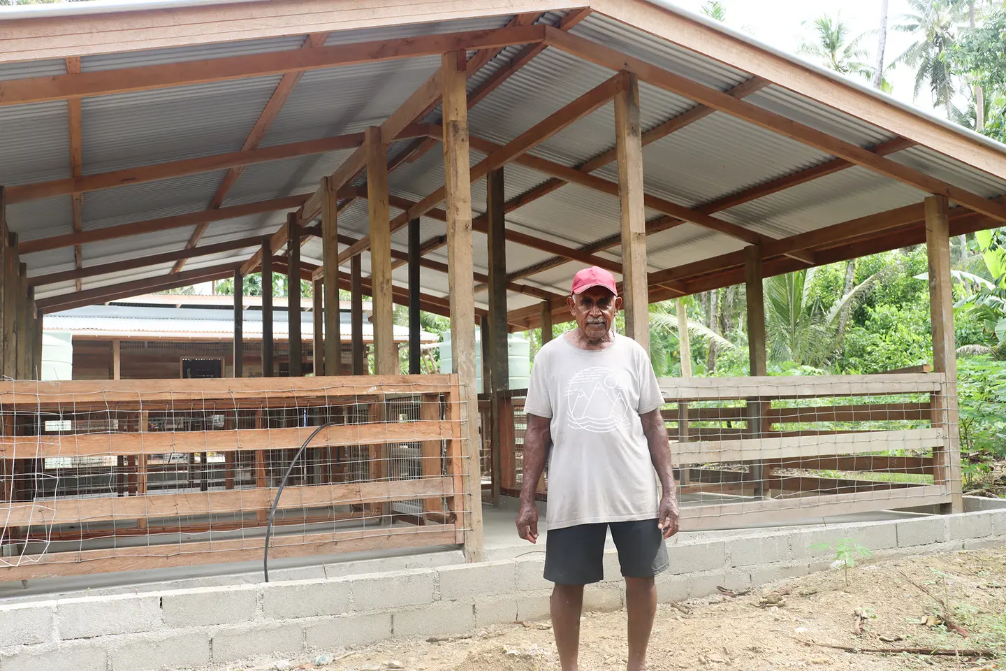 Festus Irumai, Secretary of the Ikoru Raku Farmers Association, Kiu Village, West Are'are, at the piggery shelter.
