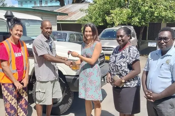 Australian High Commission First Secretary (Health) Fiona Mulhearn hands over a Land Cruiser to the Guadalcanal Provincial Health Director Dr Joel Denty. At the handing over was the Permanent Secretary for the Ministry of Health Pauline McNeil and her staff.