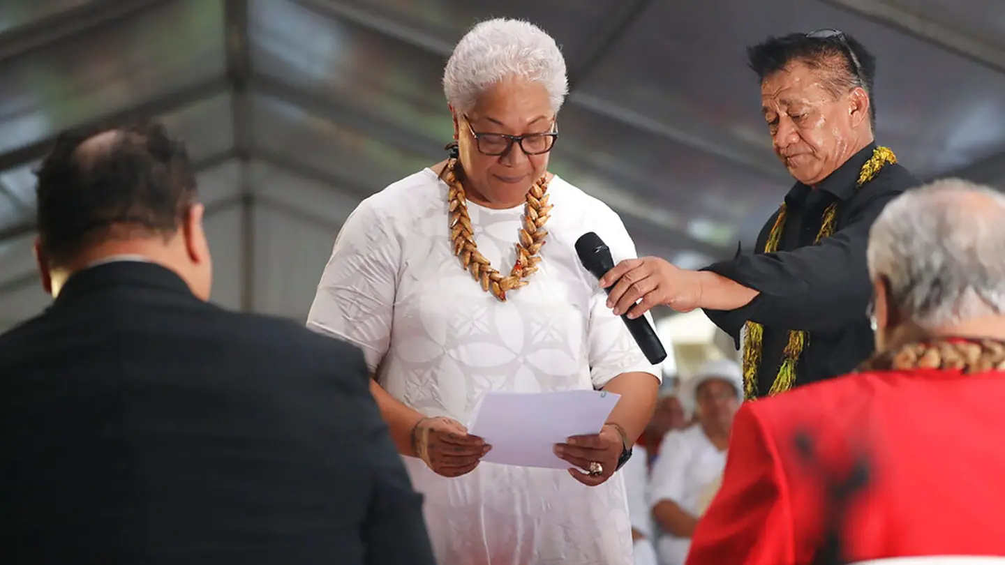Samoa's first female prime minister was locked out of parliament by the country's outgoing leader - but still sworn into office in a makeshift ceremony held inside a tent.