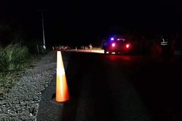 Police attend to the crime scene in the foxwood area North Guadalcanal.