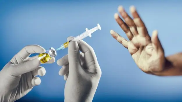 The Prime Minister says that the country is ill prepared for any community transmission of COVID-19 and urges those that are hesitant to take the jab to consult health professionals or their church leaders.