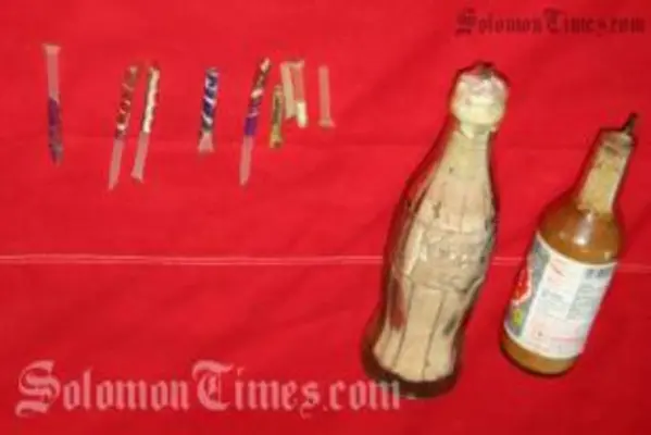Two improvised explosives made from bottles, explosive powder and  wick fuses seized by police.