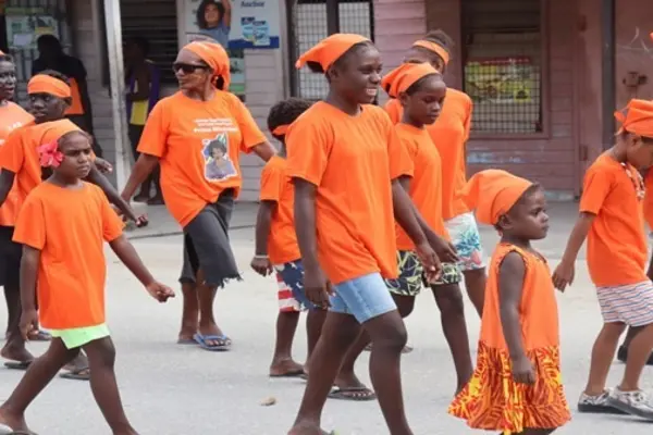 Promoting the 16 Days of Activism and walking against corruption are children, during the Anti-Corruption Day march in Gizo.