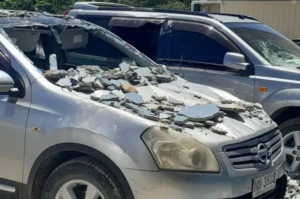 Vehicles damaged by fallen debris caused by the 7.3 magnitude earthquake. 