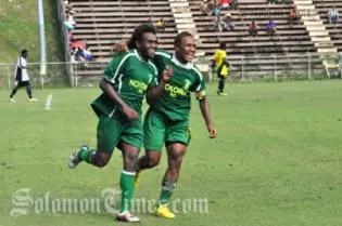 Benjamin Totori and Henry Fa'arodo Jnr celebrate Totori's goal.