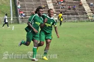 Benjamin Totori and Henry Fa'arodo Jnr celebrate Totori's goal.