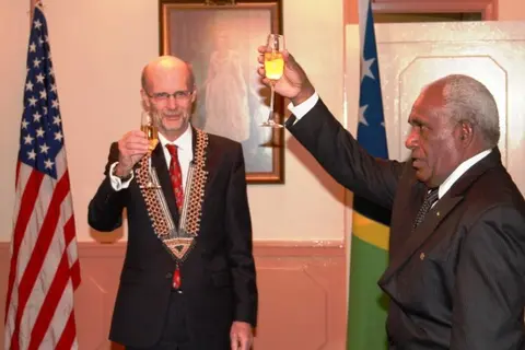 Sir Frank Kabui, the Solomon Islands Governor General proposes a toast to the people of United States while Ambassador North looks on.