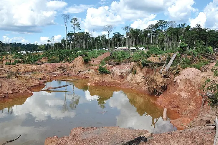 In a ute paid for by the mining company, he took Newshub to his old village - now just a crater in the red earth.