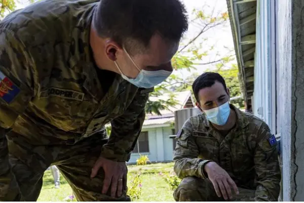 Australian Army engineers, Lieutenant Colonel Gavin Cooper and Captain Luke Staples inspect the National Referral Hospital in Honiara for damage.