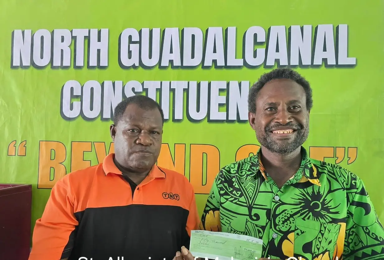 Cheque for All Saints of Melanesia Bubulu Anglican Church received by Zone 5 Chairman Paterson Ngelea.