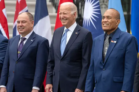 President Joe Biden, center, stands with Cook Islands Prime Minister Mark Stephen Brown, left, and Kiribati's President Taneti Maamau during a group photo with Pacific Islands Forum leaders at the White House in Washington.