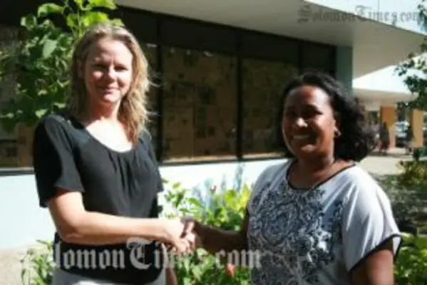 AusAID Development Counsellor, Juliette Brassington, congratulating Australian Leadership Award winner Joyce Maetoloa who will be studying Tourism at Masters level at the University of Queensland.