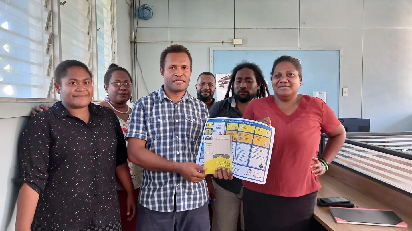 SIBC Editor, Fred Osifelo, receiving the materials from MASI President Georgina Kekea on behalf of SIBC newsroom team.