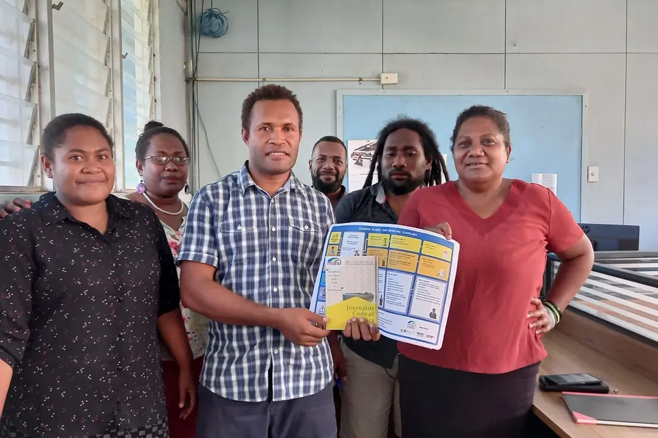 SIBC Editor, Fred Osifelo, receiving the materials from MASI President Georgina Kekea on behalf of SIBC newsroom team.