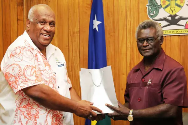 PIDF Deputy Director General, Mr Lomaloma presents a gift to the PIDF Chair, Prime Minister Sogavare at their meeting.