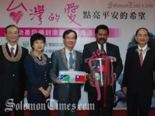 Solomon Islands Ambassador to Taiwan, Victor Ngele, while receiving the items.