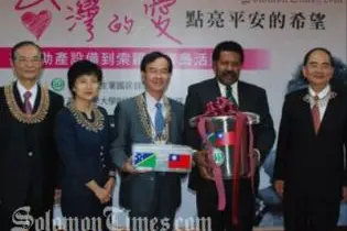 Solomon Islands Ambassador to Taiwan, Victor Ngele, while receiving the items.