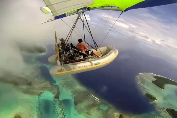Incredible footage shows the colours of the sea and the islands under Ben. Ben can be seen in the video leaning over the edge of the boat to get photographs.