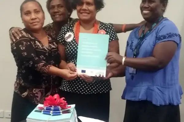 Permanent Secretary for Ministry of Women, Youth, Children and Family Affairs, Ethel Sigimanu (C) with staff at her Ministry.