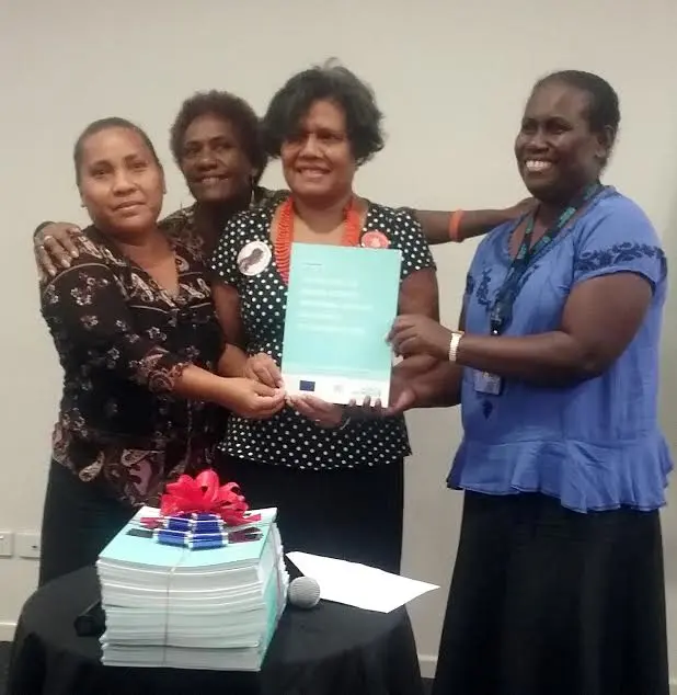 Permanent Secretary for Ministry of Women, Youth, Children and Family Affairs, Ethel Sigimanu (C) with staff at her Ministry.