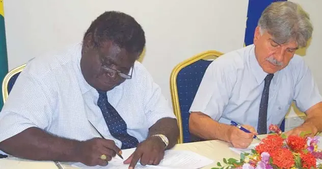 Minister for Development Planning and Aid Coordination, Hon Philip, left, and the EU Ambassador to Solomon Islands HE Tezapsidis sign the SBD$90-Million financing agreement.