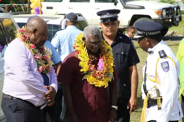 Prime Minister Manasseh Sogavare being met on arrival by the Premier of Guadalcanal.