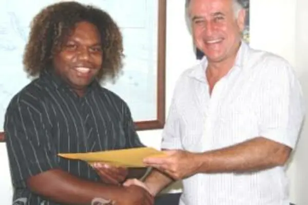 HE Mr Frank Ingruber, congratulating Mr Lamani on his selection and presenting him with travelling documents and other material for the internship.