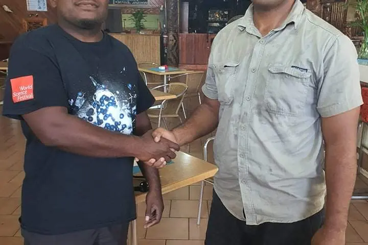 Junior Wale of Malaita Crusaders Rugby Club and Calwyn Tengemoana of Eastern Highlanders Rugby, shook hands after yesterday’s successful meeting to finalise all arrangements for the ‘Warriors Clash’.